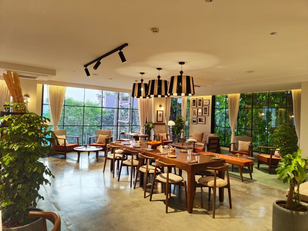 Restaurant lounge interior with natural light and modern seating