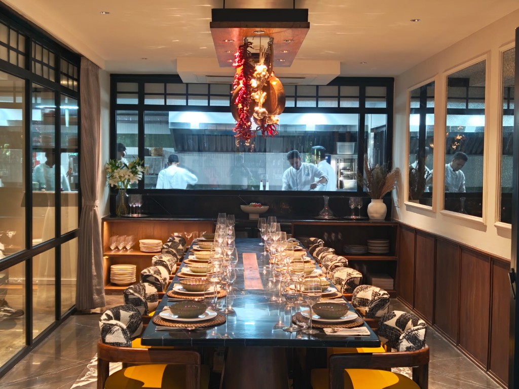Private dining room with marble table and open kitchen view