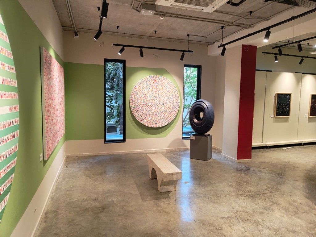 Contemporary art gallery with green and red architectural accents