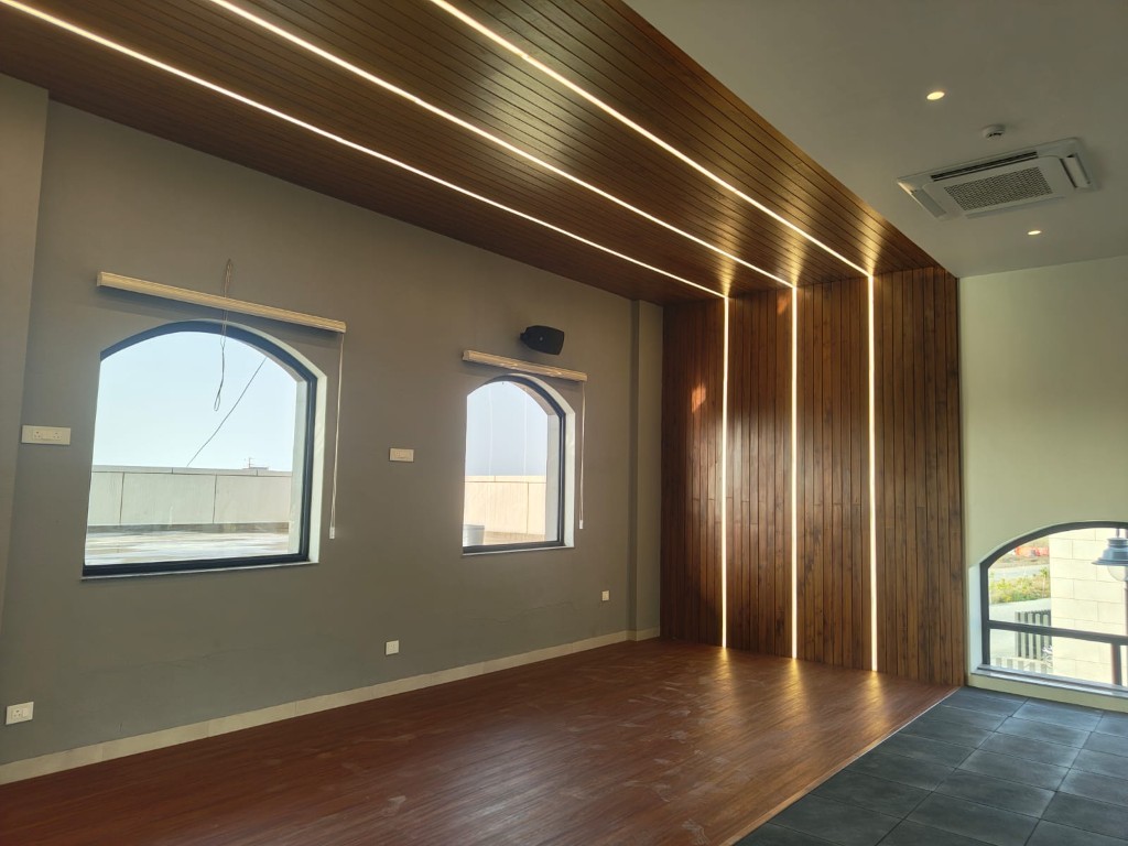 Modern residence with wood ceiling accents and arched windows